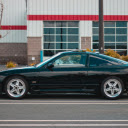 Modern black car parked on edge of road  screen for extension Chrome web store in OffiDocs Chromium
