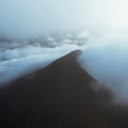 Mountain peak covered with forest in fog  screen for extension Chrome web store in OffiDocs Chromium