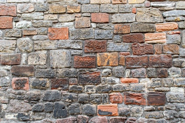 Download gratuito Sfondo muro di pietra naturale - foto o immagine gratuita da modificare con l'editor di immagini online GIMP