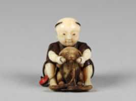 Free download Netsuke of Boy Playing with a Dog free photo or picture to be edited with GIMP online image editor