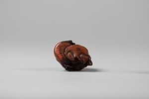 Free download Netsuke of Hotei and Bag with Fan free photo or picture to be edited with GIMP online image editor
