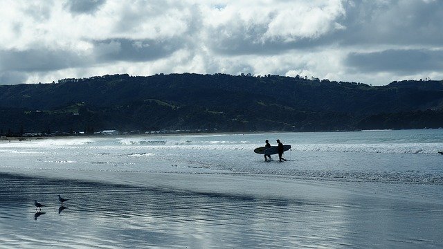 Free download New Zealand Omaha Beach Surfers -  free photo or picture to be edited with GIMP online image editor