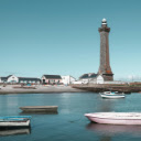 Penmarch Lighthouse with Boats in Brittany Harbor  screen for extension Chrome web store in OffiDocs Chromium