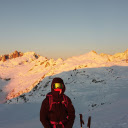 Person in Jacket and Goggles in Mountains at Sunset  screen for extension Chrome web store in OffiDocs Chromium