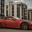 Photo of Red Coupe Parked in Pavement  screen for extension Chrome web store in OffiDocs Chromium