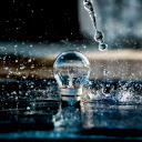 raindrops falling onto a glowing light bulb  screen for extension Chrome web store in OffiDocs Chromium