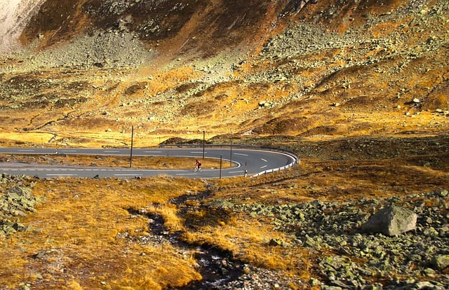 Free download rocks highway the alps cyclist free picture to be edited with GIMP free online image editor