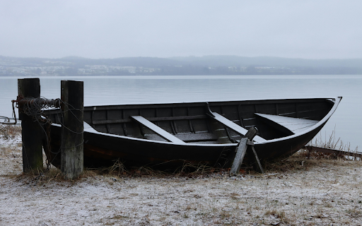 Abandoned Boat Near Lake in Wintry  from Chrome web store to be run with OffiDocs Chromium online