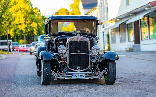 A Black Vintage Car on Road  from Chrome web store to be run with OffiDocs Chromium online