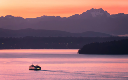 A Boat near a Shore with View of Mountains at Sunset  from Chrome web store to be run with OffiDocs Chromium online
