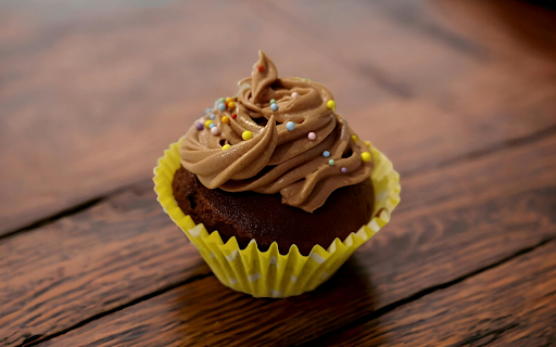 A brownie with nuts and pecans on a wooden table  from Chrome web store to be run with OffiDocs Chromium online