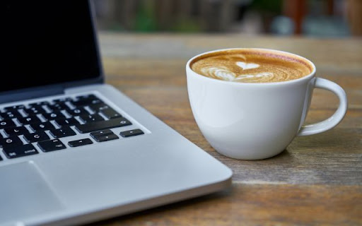 A Cup of Cappuccino Beside a Laptop  from Chrome web store to be run with OffiDocs Chromium online