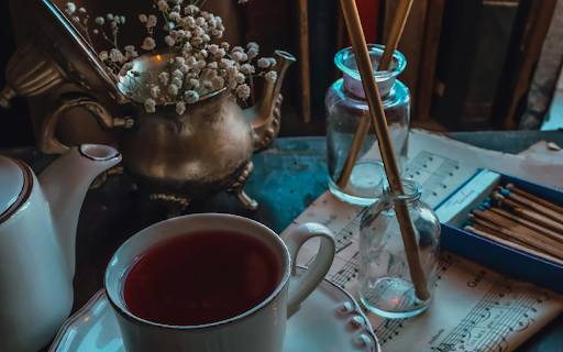 A Cup of Tea beside Lighted Candles  from Chrome web store to be run with OffiDocs Chromium online