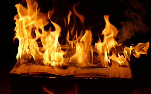A fire is burning in a box with a book  from Chrome web store to be run with OffiDocs Chromium online