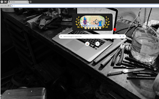A Grayscale Photo of a Laptop on a Work Table  from Chrome web store to be run with OffiDocs Chromium online