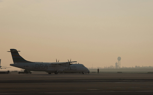 Aircraft on Runway at Sunrise in Schwechat  from Chrome web store to be run with OffiDocs Chromium online