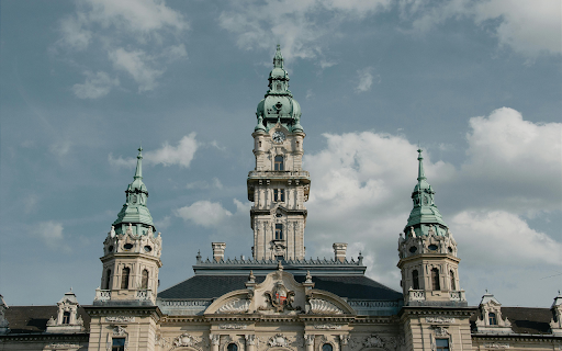 A large building with a clock tower and a blue sky  from Chrome web store to be run with OffiDocs Chromium online