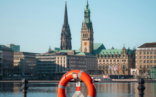 A life preserver on a pier in front of a church  from Chrome web store to be run with OffiDocs Chromium online