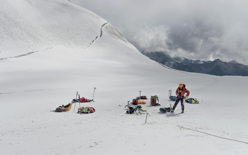 A Man Standing on Snowy Mountain  from Chrome web store to be run with OffiDocs Chromium online
