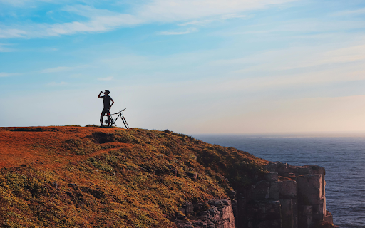 A Man with a Bicycle on a Cliff  from Chrome web store to be run with OffiDocs Chromium online