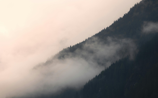 A mountain range with clouds and fog  from Chrome web store to be run with OffiDocs Chromium online