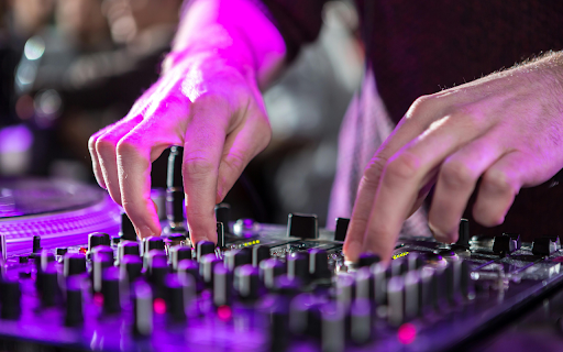 a Person Using an Audio Mixer  from Chrome web store to be run with OffiDocs Chromium online