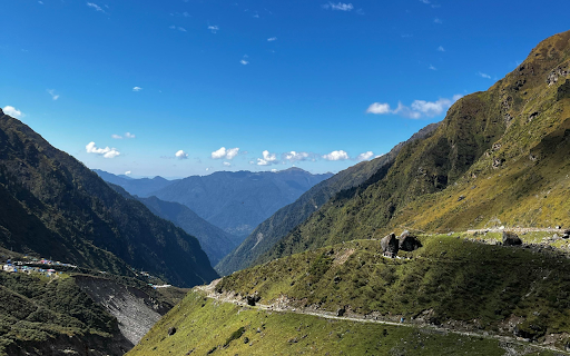 A Scenic Mountain Landscape under a Clear Blue Sky  from Chrome web store to be run with OffiDocs Chromium online