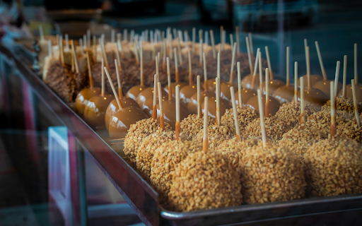 Assorted Caramel and Nut Covered Apples on Display  from Chrome web store to be run with OffiDocs Chromium online
