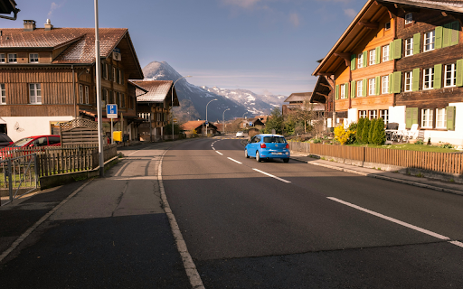 A Street between Buildings in a Town in a Valley  from Chrome web store to be run with OffiDocs Chromium online