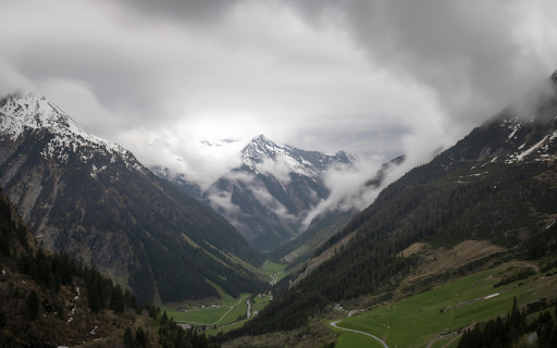 A valley with mountains and clouds in the background  from Chrome web store to be run with OffiDocs Chromium online