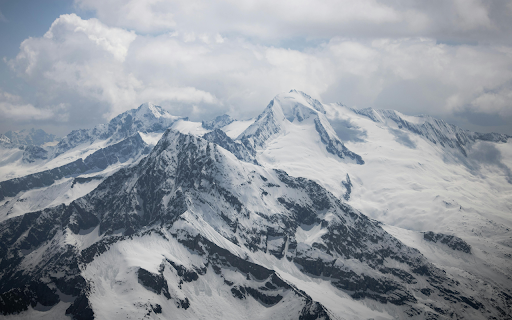 A view of snow covered mountains from an airplane  from Chrome web store to be run with OffiDocs Chromium online
