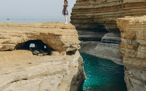A Woman Standing on a Cliff in Sidari, Corfu  from Chrome web store to be run with OffiDocs Chromium online