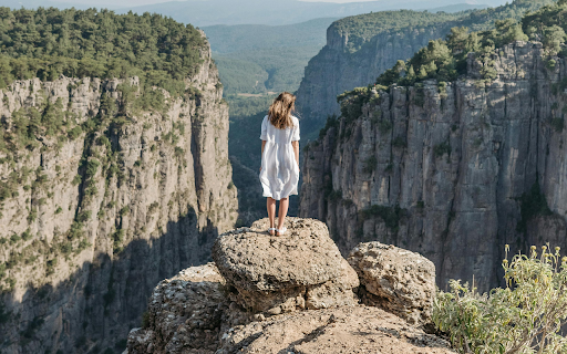 Back View of a Woman in a White Dress at Tazı Kanyonu  from Chrome web store to be run with OffiDocs Chromium online