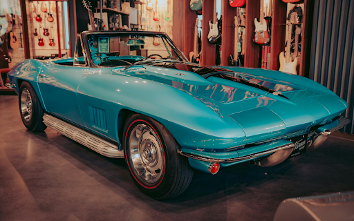 Blue Chevrolet Car Parked Inside the Guitar Store  from Chrome web store to be run with OffiDocs Chromium online