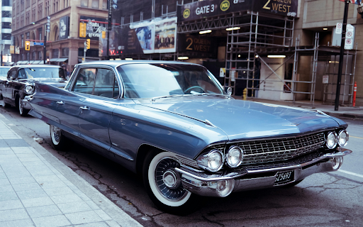 Blue Classic Car Parked on Street  from Chrome web store to be run with OffiDocs Chromium online