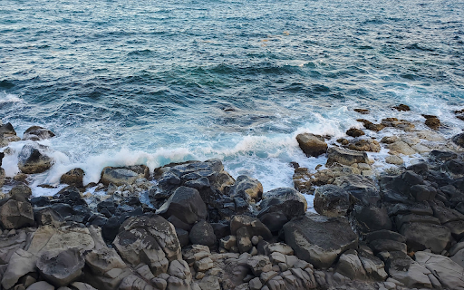 Blue Sea and Rocky Beach  from Chrome web store to be run with OffiDocs Chromium online