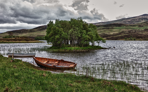 Boats docked along the river  from Chrome web store to be run with OffiDocs Chromium online
