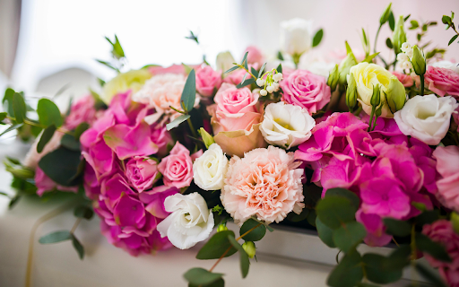 Bouquet of fresh flowers in white vessel  from Chrome web store to be run with OffiDocs Chromium online