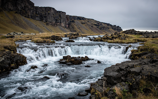 Cascading River Through Rugged Cliffs  from Chrome web store to be run with OffiDocs Chromium online