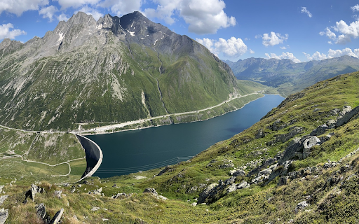 Cloudy mountains and blue water  from Chrome web store to be run with OffiDocs Chromium online