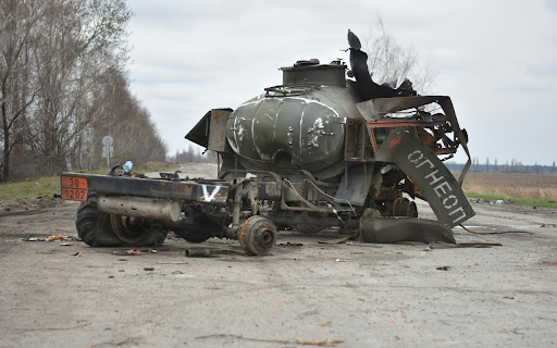 Destroyed Battle Tank on Road  from Chrome web store to be run with OffiDocs Chromium online