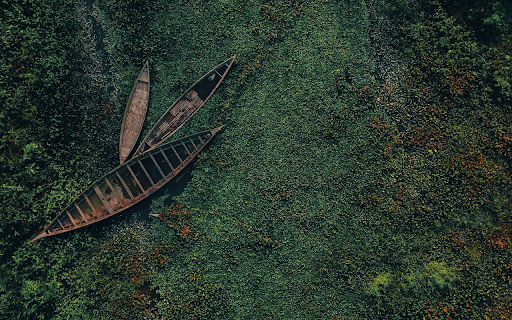 Dinghy boat floating on the river  from Chrome web store to be run with OffiDocs Chromium online