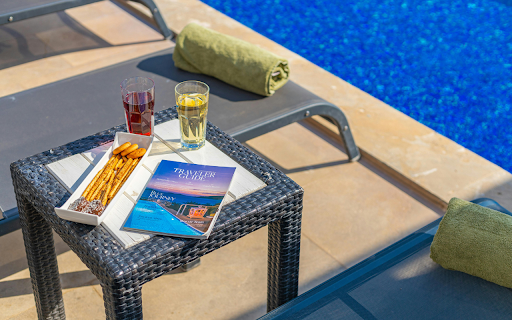 Drinks and a Snack on the Table by the Swimming Pool  from Chrome web store to be run with OffiDocs Chromium online