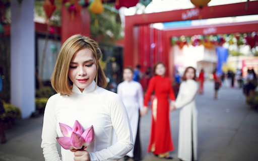 Girl holding a lotus flower  from Chrome web store to be run with OffiDocs Chromium online