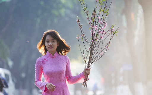 Girl holding a peach branch  from Chrome web store to be run with OffiDocs Chromium online
