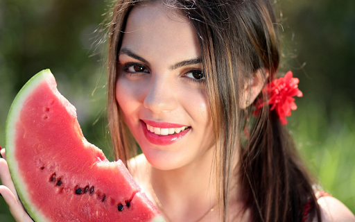 Girl holding a piece of watermelon  from Chrome web store to be run with OffiDocs Chromium online