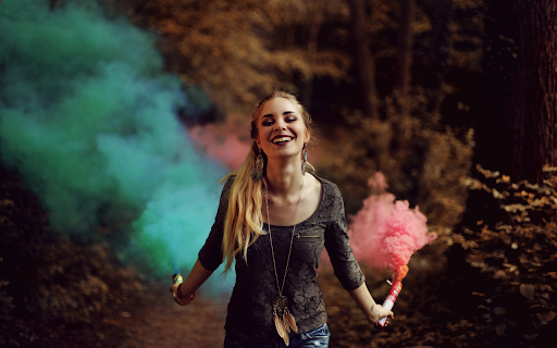 Girl holding smoke fireworks  from Chrome web store to be run with OffiDocs Chromium online