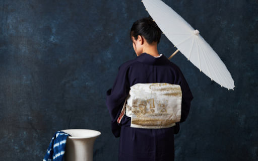 Girl in a Navy Blue Kimono Holding an Umbrella  from Chrome web store to be run with OffiDocs Chromium online