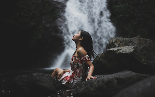 Girl sitting by the waterfall  from Chrome web store to be run with OffiDocs Chromium online