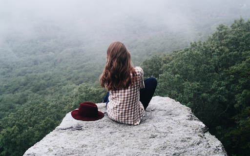 Girl sitting on a rock  from Chrome web store to be run with OffiDocs Chromium online